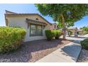 Charming one-story home with well-maintained landscaping at 18337 W Stinson Dr, Surprise, AZ 85374