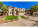 Two-story house with a three-car garage and landscaped front yard at 5389 S Scott Pl, Chandler, AZ 85249