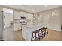 Modern kitchen with granite countertops and island at 30346 W Columbus Ave, Buckeye, AZ 85396