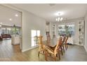 Bright dining room with hardwood floors and built-in shelving at 30346 W Columbus Ave, Buckeye, AZ 85396