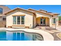Lovely backyard oasis featuring a kidney-shaped pool at 15409 W Corrine Dr, Surprise, AZ 85379