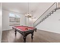 Interior view of a game room with a pool table and staircase at 2726 N Ricardo --, Mesa, AZ 85215