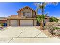 Two-story house with a three-car garage and palm trees at 2726 N Ricardo --, Mesa, AZ 85215