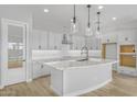 Modern kitchen with large island and stainless steel appliances at 22427 E Oriole Way, Queen Creek, AZ 85142
