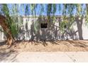 Exterior view of a condo with storage and a tree at 4820 N 89Th Ave # 100, Phoenix, AZ 85037