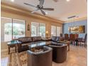Spacious living room featuring a comfortable seating area and large windows at 16917 W Sheridan St, Goodyear, AZ 85395
