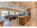 Modern kitchen boasting a large island, stainless steel appliances, and ample cabinetry at 16917 W Sheridan St, Goodyear, AZ 85395