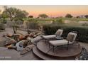 Relaxing backyard with water feature, lounge chairs, and golf course view at 22455 N 55Th St, Phoenix, AZ 85054