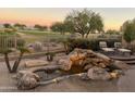 Peaceful water feature with stacked rocks in the backyard at 22455 N 55Th St, Phoenix, AZ 85054