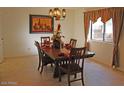 Bright dining room with wood table and chairs, ready for gatherings at 7435 E Sundance Trl # 403, Carefree, AZ 85377