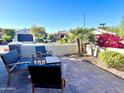 Relaxing patio area with seating and desert landscaping at 6431 W Sandpiper Way, Florence, AZ 85132