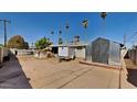 Large backyard with a shed, pool, and plenty of space for outdoor activities at 1701 W Highland Ave, Phoenix, AZ 85015