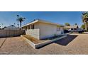 Side view of the house showcasing its clean lines and landscaping at 1701 W Highland Ave, Phoenix, AZ 85015