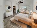 Main bedroom with ensuite bathroom and a relaxing sitting area at 563 S 230Th Ave, Buckeye, AZ 85326