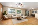 Living room with comfortable seating and a large window at 18514 W Statler St, Surprise, AZ 85388