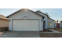 House exterior featuring a white garage door at 7394 N 67Th Dr, Glendale, AZ 85303