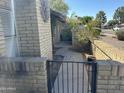 Sidewalk and gated entry to the back of the property at 6415 S Newberry Rd # C, Tempe, AZ 85283