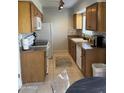 Modern kitchen featuring wood cabinets and tile backsplash at 6415 S Newberry Rd # C, Tempe, AZ 85283