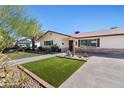 Ranch style home with front yard landscaping at 127 E Garfield St, Tempe, AZ 85288