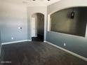 Spacious bedroom with neutral walls and carpet flooring at 41041 W Somers Dr, Maricopa, AZ 85138