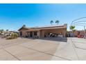 Brick ranch house with solar panels and a carport at 4701 W Aire Libre Ave, Glendale, AZ 85306