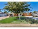 Ranch style home with a well manicured lawn at 7830 N 17Th Ave, Phoenix, AZ 85021