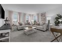 Bright and airy living area with two sofas and a coffee table at 3721 S 83Rd Dr, Tolleson, AZ 85353