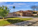 Single-story home with attached garage and well-maintained landscaping at 1413 W Commerce Ave, Gilbert, AZ 85233