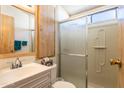 Bathroom with shower stall, vanity, and mirror at 7750 E Broadway Rd # 277, Mesa, AZ 85208