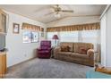 Living room with sofa, recliner, and carpet flooring at 7750 E Broadway Rd # 277, Mesa, AZ 85208