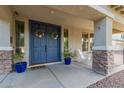 Welcoming front porch with double doors and stylish planters at 3353 E Blue Ridge Way, Gilbert, AZ 85298