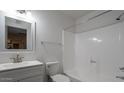 Updated bathroom with white vanity, bathtub, and shower at 2625 E 10Th St, Tempe, AZ 85288
