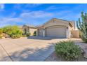 Single-story home with two-car garage and desert landscaping at 5221 E Thunder Hawk Rd, Cave Creek, AZ 85331