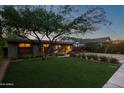 Mid-century modern home with lawn and landscaping at 4135 E Glenrosa Ave, Phoenix, AZ 85018