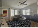 Living room with sectional sofa, coffee table, and patterned rug at 650 N Hawes Rd # 4409, Mesa, AZ 85207