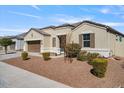 Single-story home with a two-car garage and landscaping at 269 S 190Th Dr, Buckeye, AZ 85326