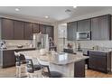 Spacious kitchen with granite countertops, stainless steel appliances, and an island at 269 S 190Th Dr, Buckeye, AZ 85326