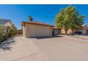 Single story home with a two-car garage and a long driveway at 16410 S 46Th Pl, Phoenix, AZ 85048