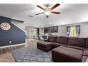 Spacious living room with L-shaped sectional sofa and kitchen view at 960 W 20Th St, Florence, AZ 85132