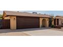House front with a two-car garage and arched entryway at 3837 W Dailey St, Phoenix, AZ 85053