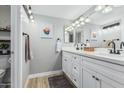 Double vanity bathroom with white cabinets and quartz countertop at 12222 N Paradise Village Pkwy # 142, Phoenix, AZ 85032