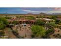 Home with a pool and desert landscaping, mountain views in the background at 36482 N Boulder View Dr, Scottsdale, AZ 85262