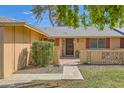 Inviting front entrance with walkway, landscaping, and a well-maintained yard at 13605 N Redwood Dr, Sun City, AZ 85351