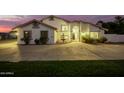 Two story home with fountain and large yard at dusk at 7329 N 173Rd Ave, Waddell, AZ 85355