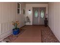 Front entry with security door and pathway at 12518 W Parkwood Dr, Sun City West, AZ 85375