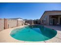 Kidney shaped pool with block wall and backyard access at 786 W Jahns Dr, Casa Grande, AZ 85122