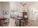 Elegant dining room adjacent to the living room with hardwood floors at 36382 N 35Th St, Cave Creek, AZ 85331