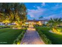 Stunning curb appeal with a brick walkway and mature trees at 6112 E Cortez Dr, Scottsdale, AZ 85254