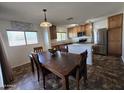 Kitchen with wood cabinets, stainless steel appliances, and an island at 10812 W College Dr, Phoenix, AZ 85037