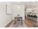 Bright dining area with hardwood floors and view of kitchen at 5151 N 13Th Pl # 17, Phoenix, AZ 85014